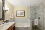 Exquisite marble-finished tub and shower